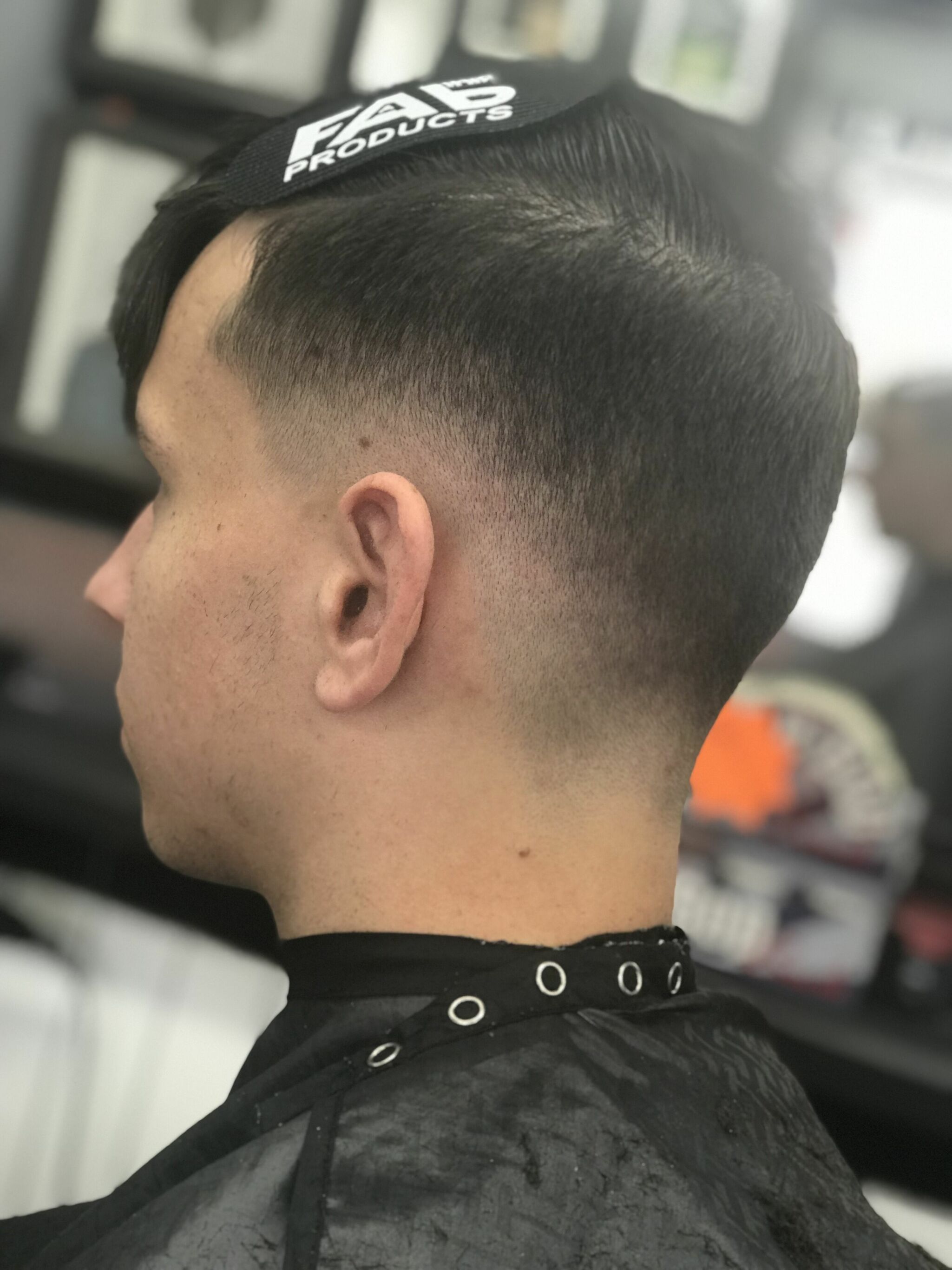Taper fade with a side-swept top